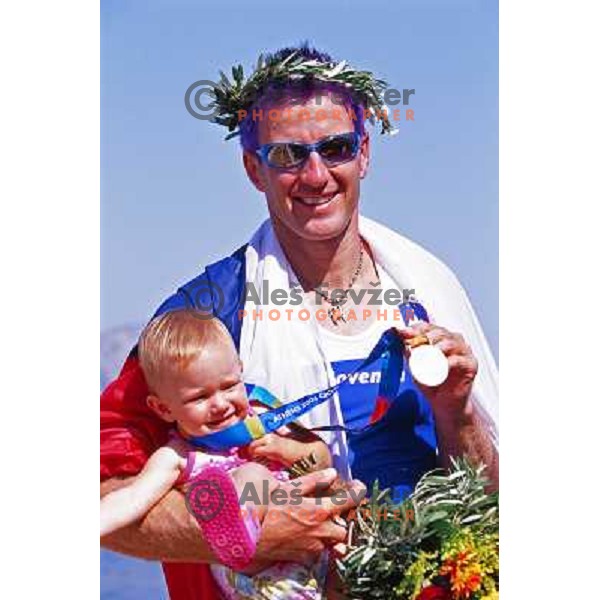 Iztok Cop of Slovenia, silver medalist in rowing at Summer Olympic Games in Athens, Greece , August 2004 pictured with his daughter Ruby 