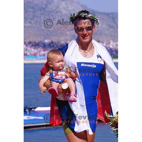 Iztok Cop of Slovenia, silver medalist in rowing at Summer Olympic Games in Athens, Greece , August 2004 pictured with his daughter Ruby 