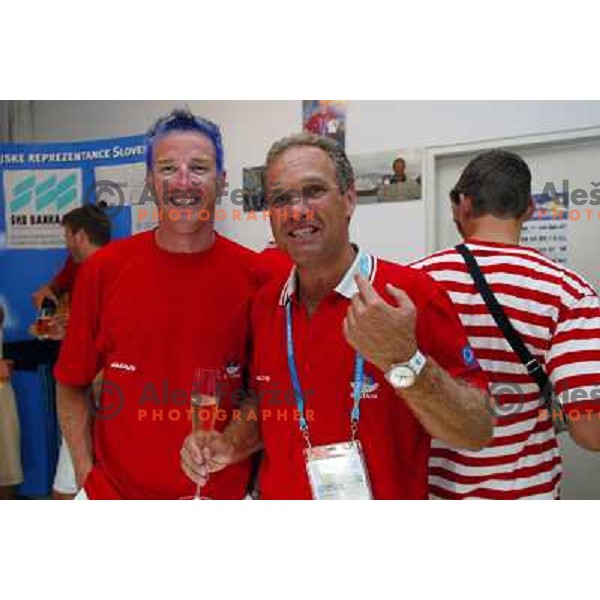 Iztok Cop of Slovenia, silver medalist in rowing at Summer Olympic Games in Athens, Greece , August 2004 during reception for sponsors and press in Slovenia house pictured with Damjan Pintar 