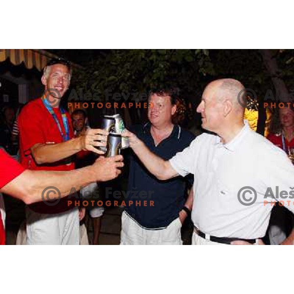 Luka Spik of Slovenia, silver medalist in rowing at Summer Olympic Games in Athens, Greece , August 2004 during reception for sponsors and press in Slovenia house pictured with Bosko Srot and Tone Turnsek 