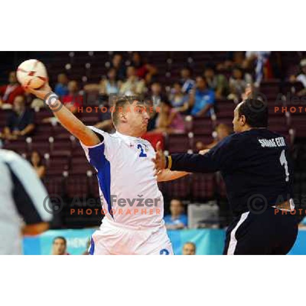 Miladin Kozlina in action during match Slovenia-Egypt at handball tournament at Summer Olympic Games Athens 2004, Greece 
