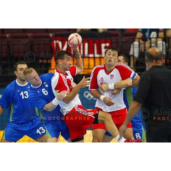 Ivano Balic of Croatia and Andrej Kastelic of Slovenia in action during Handball tournament at Summer Olympic Games Athens 2004, Greece. Slovenia played with Croatia on August 15, 2004 