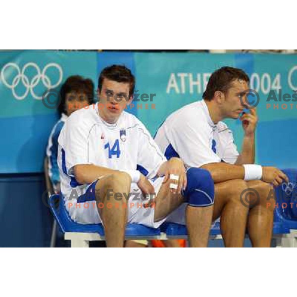 Sergej Rutenka, Tomaz Tomsic of Slovenia in action during Handball tournament at Summer Olympic Games Athens 2004, Greece. Slovenia played with Iceland on August 18, 2004 