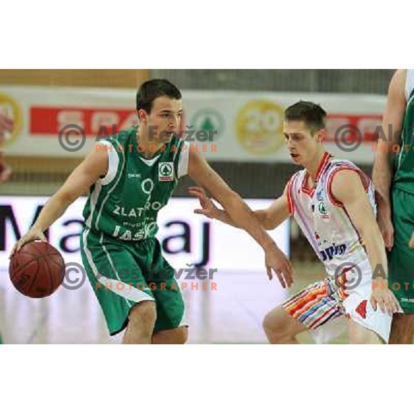 Uros Zadnik of Geoplin Slovan and Danijel Vujasinovic of Zlatorog in action during basketball match in quarter-final of Spar Cup, played in Poden Sports Hall, Skofja Loka, Slovenia on Feburary 11, 2011 