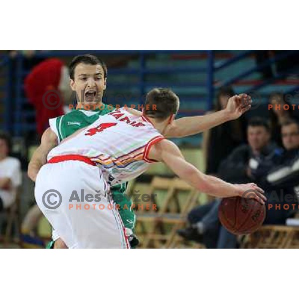 Uros Zadnik of Geoplin Slovan and Danijel Vujasinovic of Zlatorog in action during basketball match in quarter-final of Spar Cup, played in Poden Sports Hall, Skofja Loka, Slovenia on Feburary 11, 2011 