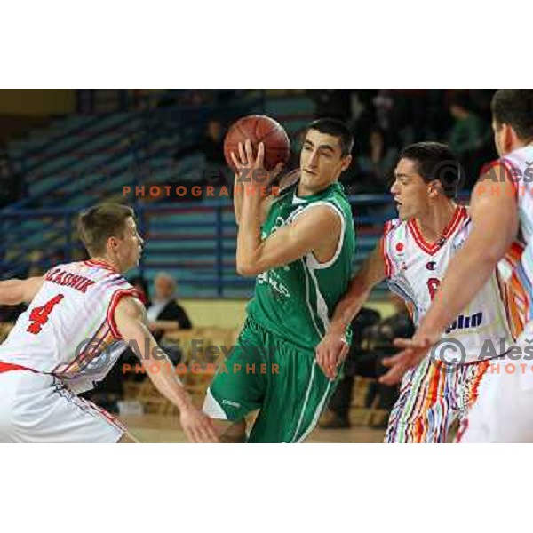 Uros Zadnik, Dejan Cigoja of Geoplin Slovan and Vladimir Panic of Zlatorog in action during basketball match in quarter-final of Spar Cup, played in Poden Sports Hall, Skofja Loka, Slovenia on Feburary 11, 2011 