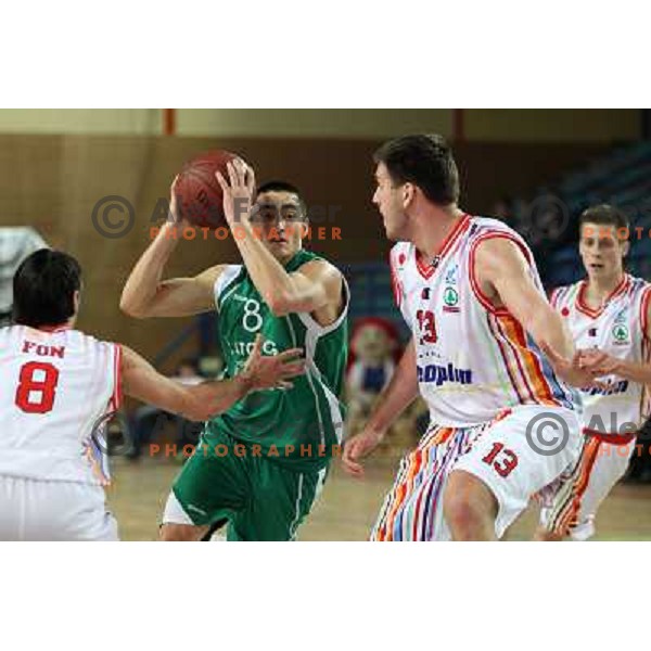 Matej Krusic of Geoplin Slovan and Vladimir Panic of Zlatorog in action during basketball match in quarter-final of Spar Cup, played in Poden Sports Hall, Skofja Loka, Slovenia on Feburary 11, 2011 