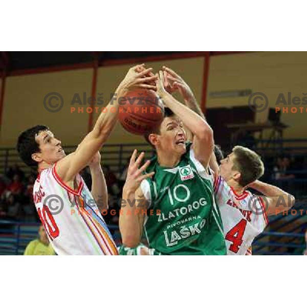Miha Markic of Geoplin Slovan and Alen Omic of Zlatorog in action during basketball match in quarter-final of Spar Cup, played in Poden Sports Hall, Skofja Loka, Slovenia on Feburary 11, 2011 