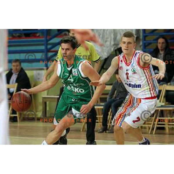  Luka Rupnik of Geoplin Slovan and Jure Pelko of Zlatorog in action during basketball match in quarter-final of Spar Cup, played in Poden Sports Hall, Skofja Loka, Slovenia on Feburary 11, 2011 