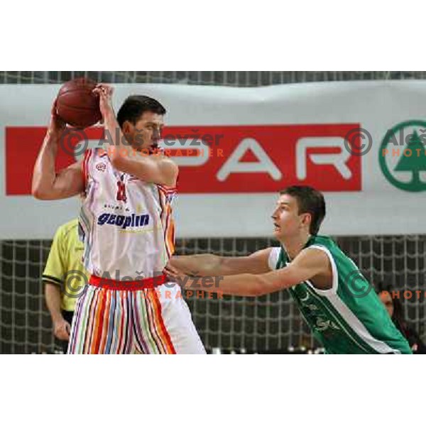Matej Krusic of Geoplin Slovan and Alen Omic of Zlatorog in action during basketball match in quarter-final of Spar Cup, played in Poden Sports Hall, Skofja Loka, Slovenia on Feburary 11, 2011 
