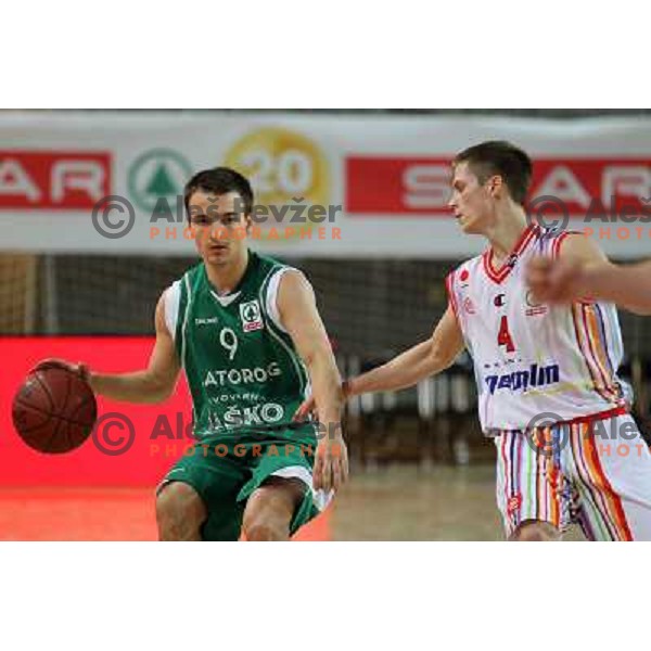 Uros Zadnik of Geoplin Slovan and Danijel Vujasinovic of Zlatorog in action during basketball match in quarter-final of Spar Cup, played in Poden Sports Hall, Skofja Loka, Slovenia on Feburary 11, 2011 