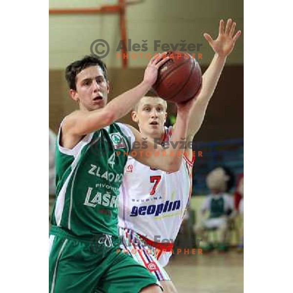 Luka Rupnik of Geoplin Slovan and Jure Pelko of Zlatorog in action during basketball match in quarter-final of Spar Cup, played in Poden Sports Hall, Skofja Loka, Slovenia on Feburary 11, 2011 
