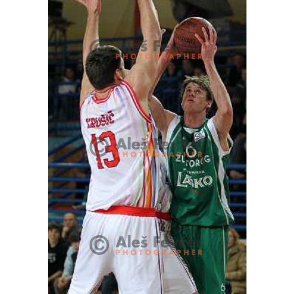 Matej Krusic of Geoplin Slovan and Luka Lapornik of Zlatorog in action during basketball match in quarter-final of Spar Cup, played in Poden Sports Hall, Skofja Loka, Slovenia on Feburary 11, 2011 