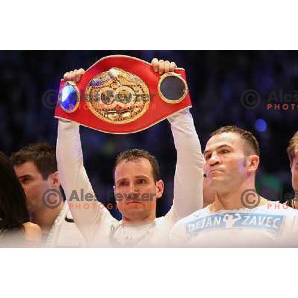 Tomaz Barada and Dejan Zavec of Slovenia (blue trunks) IBF World Boxing Champion successfully defend his walterweight title with technical knockout (TKO) in fifth round against Paul Delgado of USA (white trunks) in front of 13.000 fans in Stozice, Ljublja
