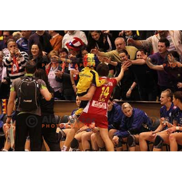 Players of Oltchim Valcea (ROM) celebrate victory over Krim Mercator (SLO) at handball match in Women\'s Championsleague played in Valcea, Romania on February 20, 2011 