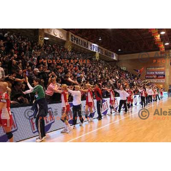 Players of Oltchim Valcea (ROM) celebrate victory over Krim Mercator (SLO) at handball match in Women\'s Championsleague played in Valcea, Romania on February 20, 2011 