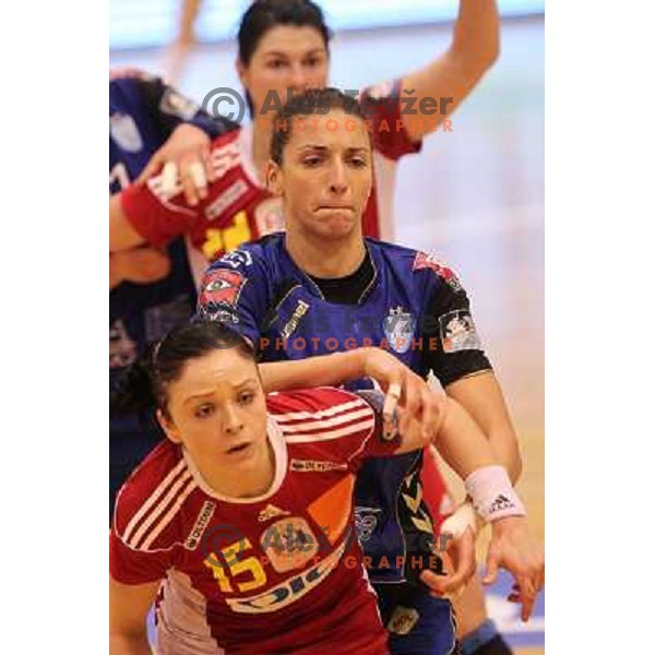 Andrea Penezic of Krim Mercator and Ardean of Oltchim Valcea in action during handball match in Women\'s Championsleague played in Valcea, Romania on February 20, 2011 