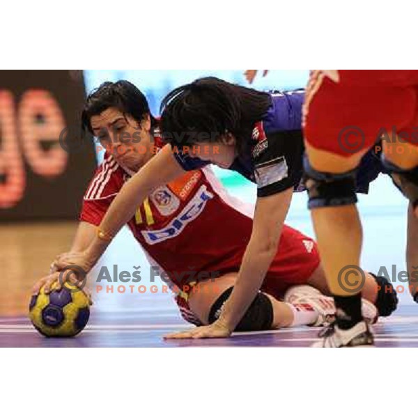 Liudmila Bodnieva of Krim Mercator (SLO) and Ozel of Oltchim Valcea in action during handball match in Women\'s Championsleague played in Valcea, Romania on February 20, 2011 