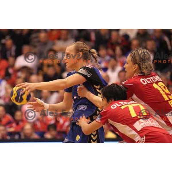Barbara Varlec of Krim Mercator and Bese of Oltchim Valcea in action during handball match in Women\'s Championsleague played in Valcea, Romania on February 20, 2011 