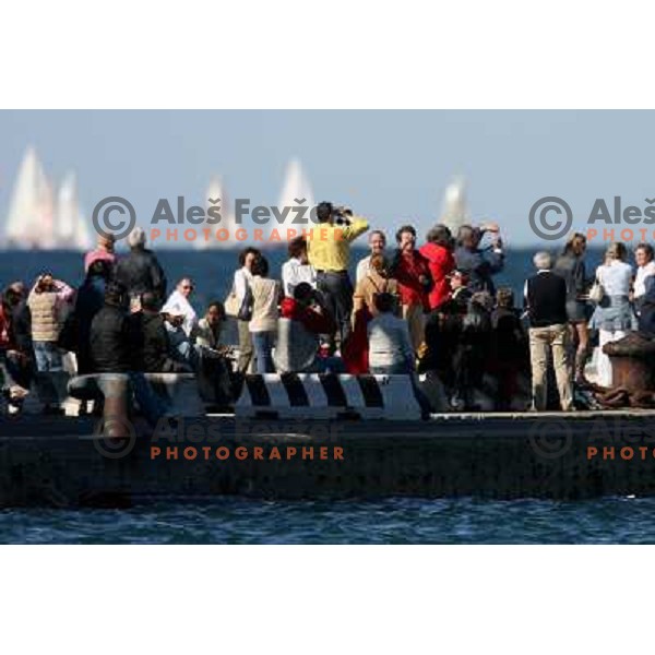 Spectators watching regatta from shore in Trieste