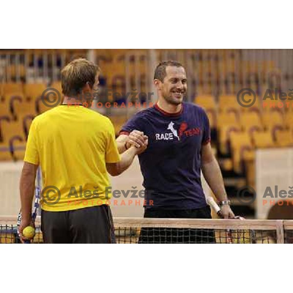 Grega Zemlja and Jure Kosir of Slovenia during exhibition tennis match in Hala Tivoli, Ljubljana, Slovenia on January 28,2010 