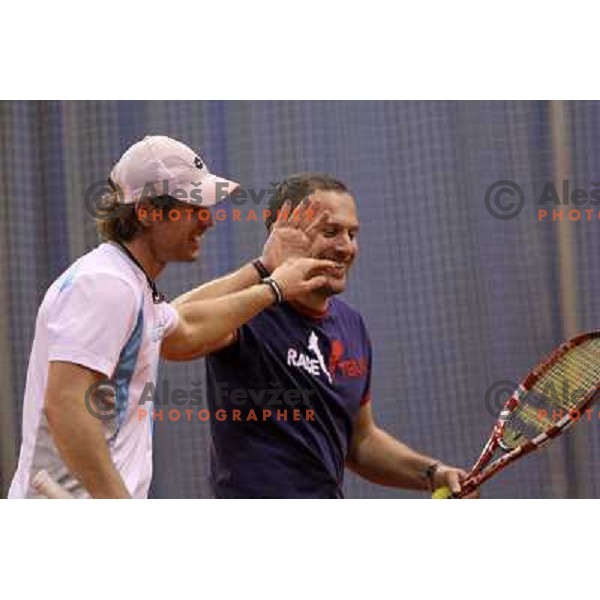 Blaz Kavcic and Jure Kosir of Slovenia during exhibition tennis match in Hala Tivoli, Ljubljana, Slovenia on January 28,2010 