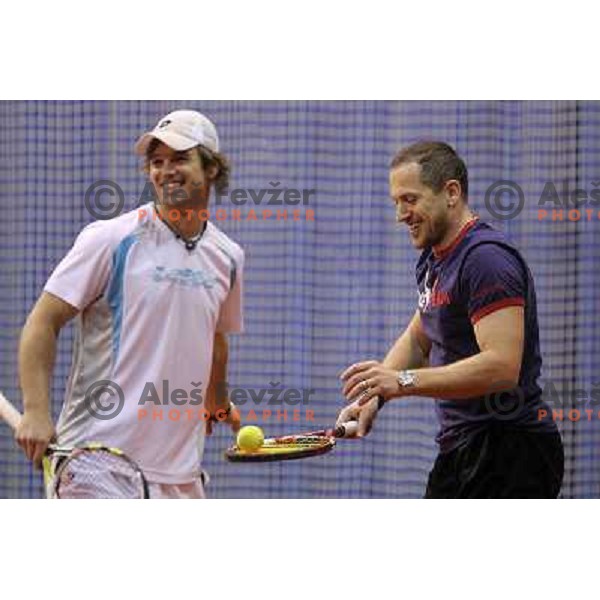 Blaz Kavcic and Jure Kosir of Slovenia during exhibition tennis match in Hala Tivoli, Ljubljana, Slovenia on January 28,2010 
