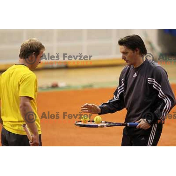 Grega Zemlja and Miran Pavlin of Slovenia during exhibition tennis match in Hala Tivoli, Ljubljana, Slovenia on January 28,2010 