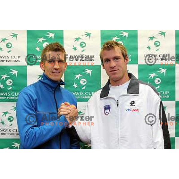 Jarkko Nieminen of Finnland and Grega Zemlja of Slovenia - singles match 1 on first day during offical draw for Davis Cup match, Hala Tivoli, Ljubljana, Slovenia on March 3, 2011 