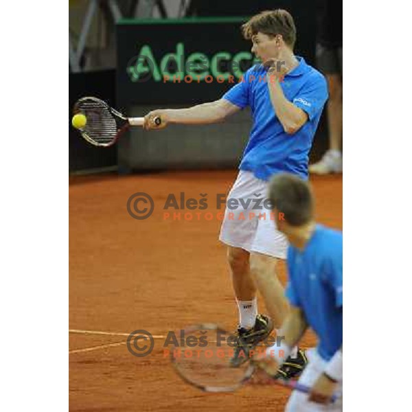 Harri Heliovaara of Finland in action during doubles match at day 1 of Davis Cup match Slovenia- Finland , played in Hala Tivoli, Ljubljana, Slovenia on March 5, 2011 