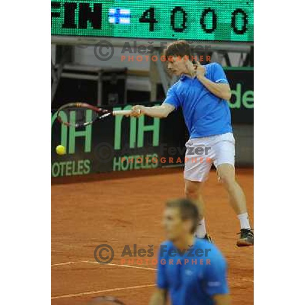 Harri Heliovaara of Finland in action during doubles match at day 1 of Davis Cup match Slovenia- Finland , played in Hala Tivoli, Ljubljana, Slovenia on March 5, 2011 