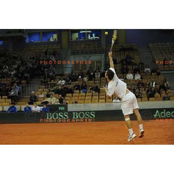 Luka Gregorc of Slovenia in action during doubles match at day 1 of Davis Cup match Slovenia- Finland , played in Hala Tivoli, Ljubljana, Slovenia on March 5, 2011 