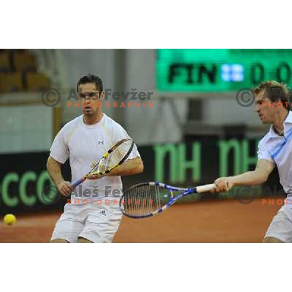 Luka Gregorc and Grega Zemlja of Slovenia in action during doubles match at day 1 of Davis Cup match Slovenia- Finland , played in Hala Tivoli, Ljubljana, Slovenia on March 5, 2011 