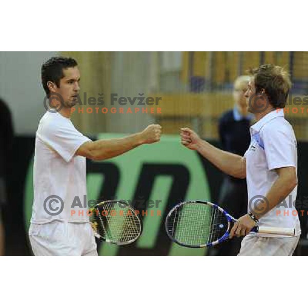 Luka Gregorc and Grega Zemlja of Slovenia in action during doubles match at day 1 of Davis Cup match Slovenia- Finland , played in Hala Tivoli, Ljubljana, Slovenia on March 5, 2011 