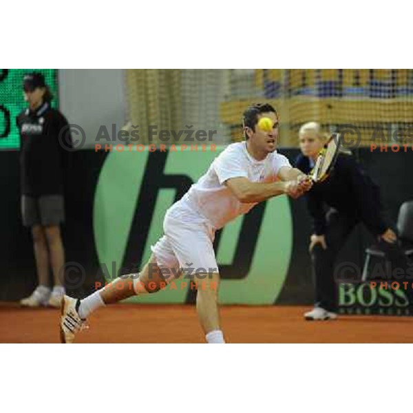 Luka Gregorc of Slovenia in action during doubles match at day 1 of Davis Cup match Slovenia- Finland , played in Hala Tivoli, Ljubljana, Slovenia on March 5, 2011 