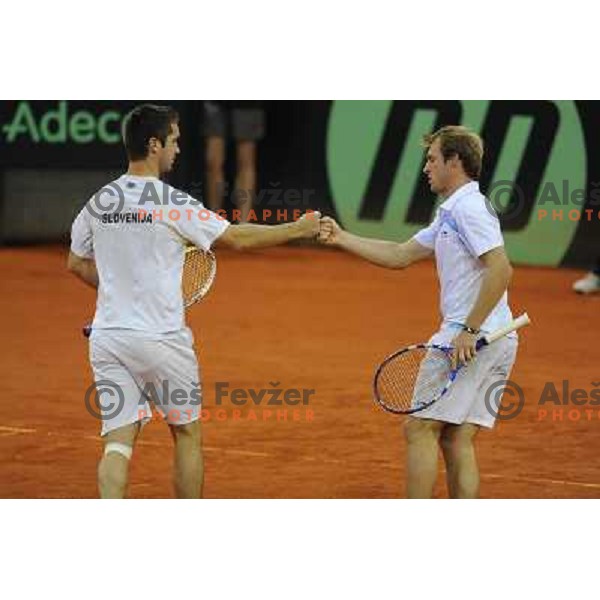 Luka Gregorc and Grega Zemlja of Slovenia in action during doubles match at day 1 of Davis Cup match Slovenia- Finland , played in Hala Tivoli, Ljubljana, Slovenia on March 5, 2011 