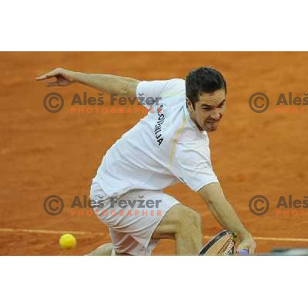 Luka Gregorc of Slovenia in action during doubles match at day 1 of Davis Cup match Slovenia- Finland , played in Hala Tivoli, Ljubljana, Slovenia on March 5, 2011 