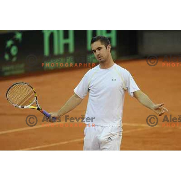 Luka Gregorc of Slovenia in action during doubles match at day 1 of Davis Cup match Slovenia- Finland , played in Hala Tivoli, Ljubljana, Slovenia on March 5, 2011 