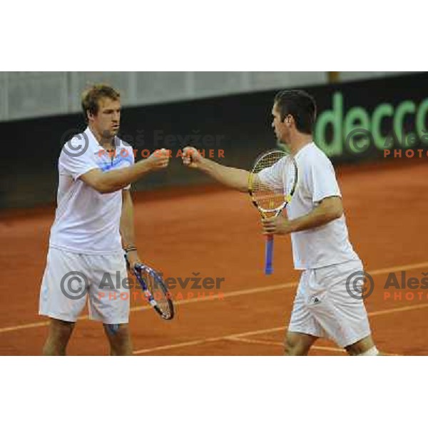 Luka Gregorc and Grega Zemlja of Slovenia in action during doubles match at day 1 of Davis Cup match Slovenia- Finland , played in Hala Tivoli, Ljubljana, Slovenia on March 5, 2011 