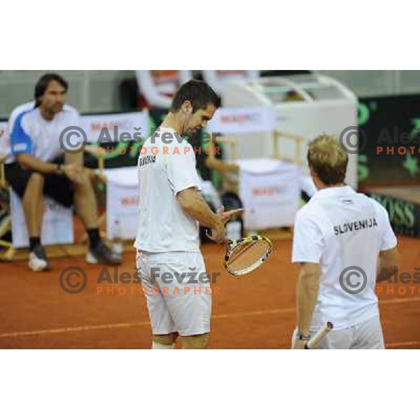 Luka Gregorc and Grega Zemlja of Slovenia in action during doubles match at day 1 of Davis Cup match Slovenia- Finland , played in Hala Tivoli, Ljubljana, Slovenia on March 5, 2011 