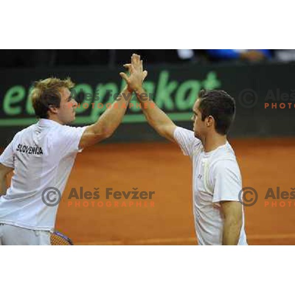 Luka Gregorc and Grega Zemlja of Slovenia in action during doubles match at day 1 of Davis Cup match Slovenia- Finland , played in Hala Tivoli, Ljubljana, Slovenia on March 5, 2011 