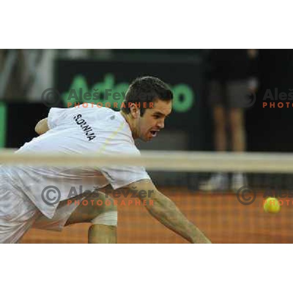 Luka Gregorc of Slovenia in action during doubles match at day 1 of Davis Cup match Slovenia- Finland , played in Hala Tivoli, Ljubljana, Slovenia on March 5, 2011 