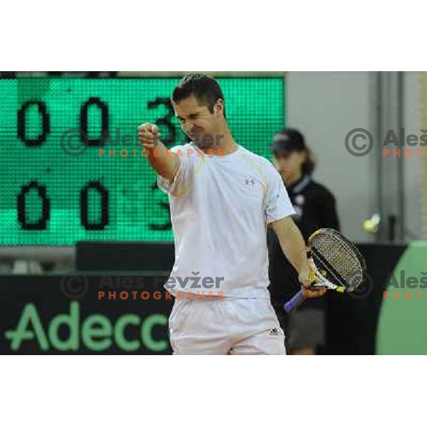 Luka Gregorc of Slovenia in action during doubles match at day 1 of Davis Cup match Slovenia- Finland , played in Hala Tivoli, Ljubljana, Slovenia on March 5, 2011 