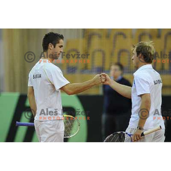 Luka Gregorc and Grega Zemlja of Slovenia in action during doubles match at day 1 of Davis Cup match Slovenia- Finland , played in Hala Tivoli, Ljubljana, Slovenia on March 5, 2011 