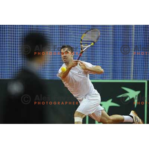 Luka Gregorc of Slovenia in action during doubles match at day 1 of Davis Cup match Slovenia- Finland , played in Hala Tivoli, Ljubljana, Slovenia on March 5, 2011 
