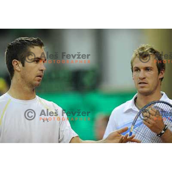 Luka Gregorc and Grega Zemlja of Slovenia in action during doubles match at day 1 of Davis Cup match Slovenia- Finland , played in Hala Tivoli, Ljubljana, Slovenia on March 5, 2011 