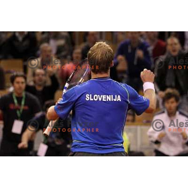 Coach Ziga Janskovec, Blaz Kavcic, Luka Gregorc, Grega Zemlja, Captain Blaz Trupej and players and staff of Slovenia celebrate victory 3:2 in Davis Cup match Slovenia- Finland, played in Hala Tivoli, Ljubljana, Slovenia on March 6, 2011 