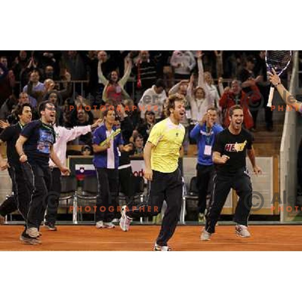 Coach Ziga Janskovec, Blaz Kavcic, Luka Gregorc, Grega Zemlja, Captain Blaz Trupej and players and staff of Slovenia celebrate victory 3:2 in Davis Cup match Slovenia- Finland, played in Hala Tivoli, Ljubljana, Slovenia on March 6, 2011 
