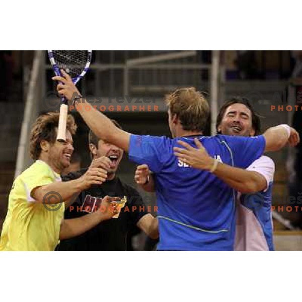 Coach Ziga Janskovec, Blaz Kavcic, Luka Gregorc, Grega Zemlja, Captain Blaz Trupej and players and staff of Slovenia celebrate victory 3:2 in Davis Cup match Slovenia- Finland, played in Hala Tivoli, Ljubljana, Slovenia on March 6, 2011 