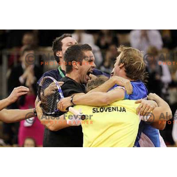 Coach Ziga Janskovec, Blaz Kavcic, Luka Gregorc, Grega Zemlja, Captain Blaz Trupej and players and staff of Slovenia celebrate victory 3:2 in Davis Cup match Slovenia- Finland, played in Hala Tivoli, Ljubljana, Slovenia on March 6, 2011 